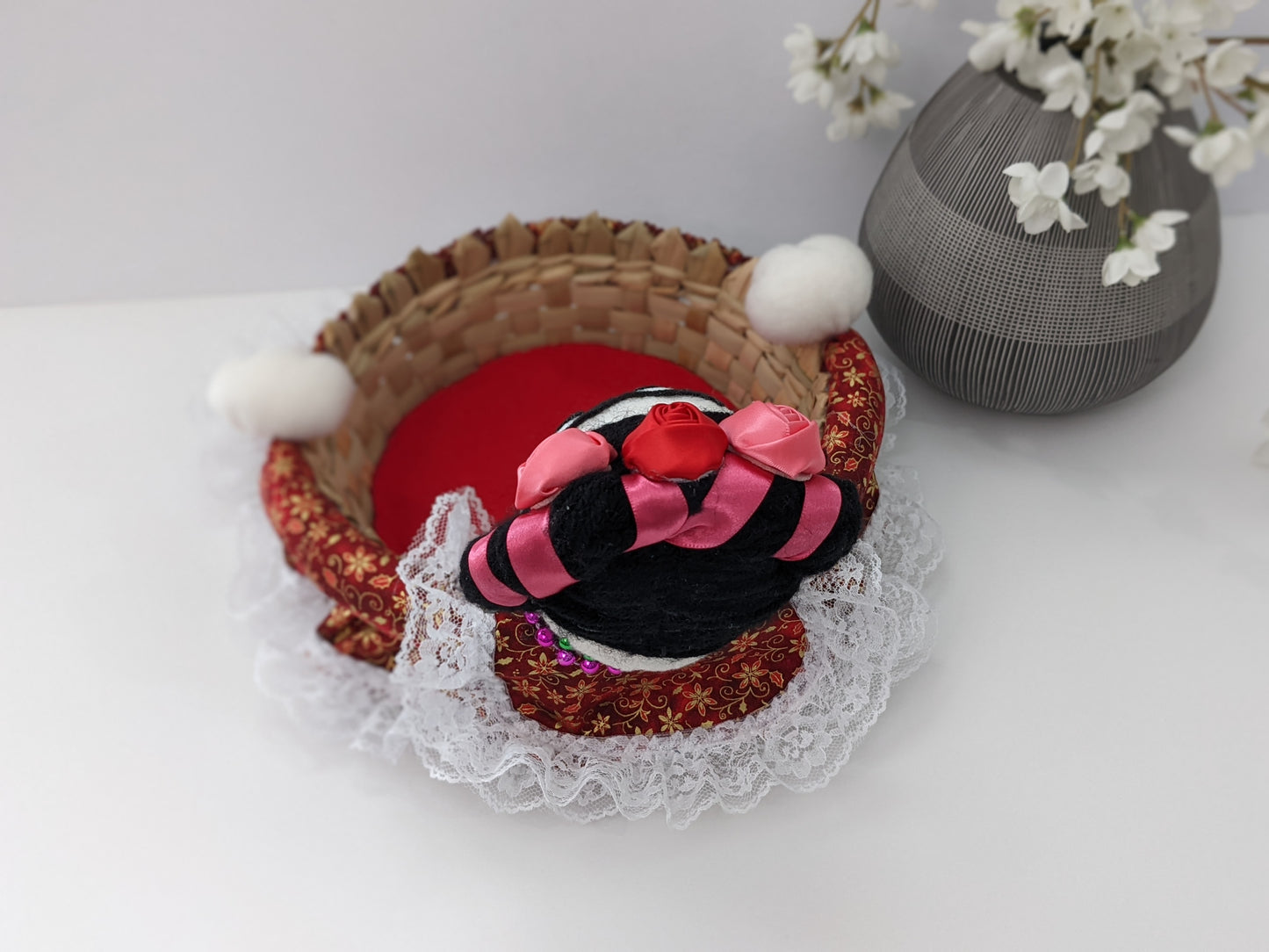Medium Decorative Basket Frida Kahlo by Luna Marie Designs. She is dressed in red/gold and Kahlo's signature hair Style. Adorned with pink and red roses. Back