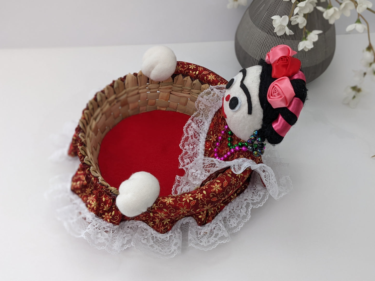 Medium Decorative Basket Frida Kahlo by Luna Marie Designs. She is dressed in red/gold and Kahlo's signature hair Style. Adorned with pink and red roses. Side b