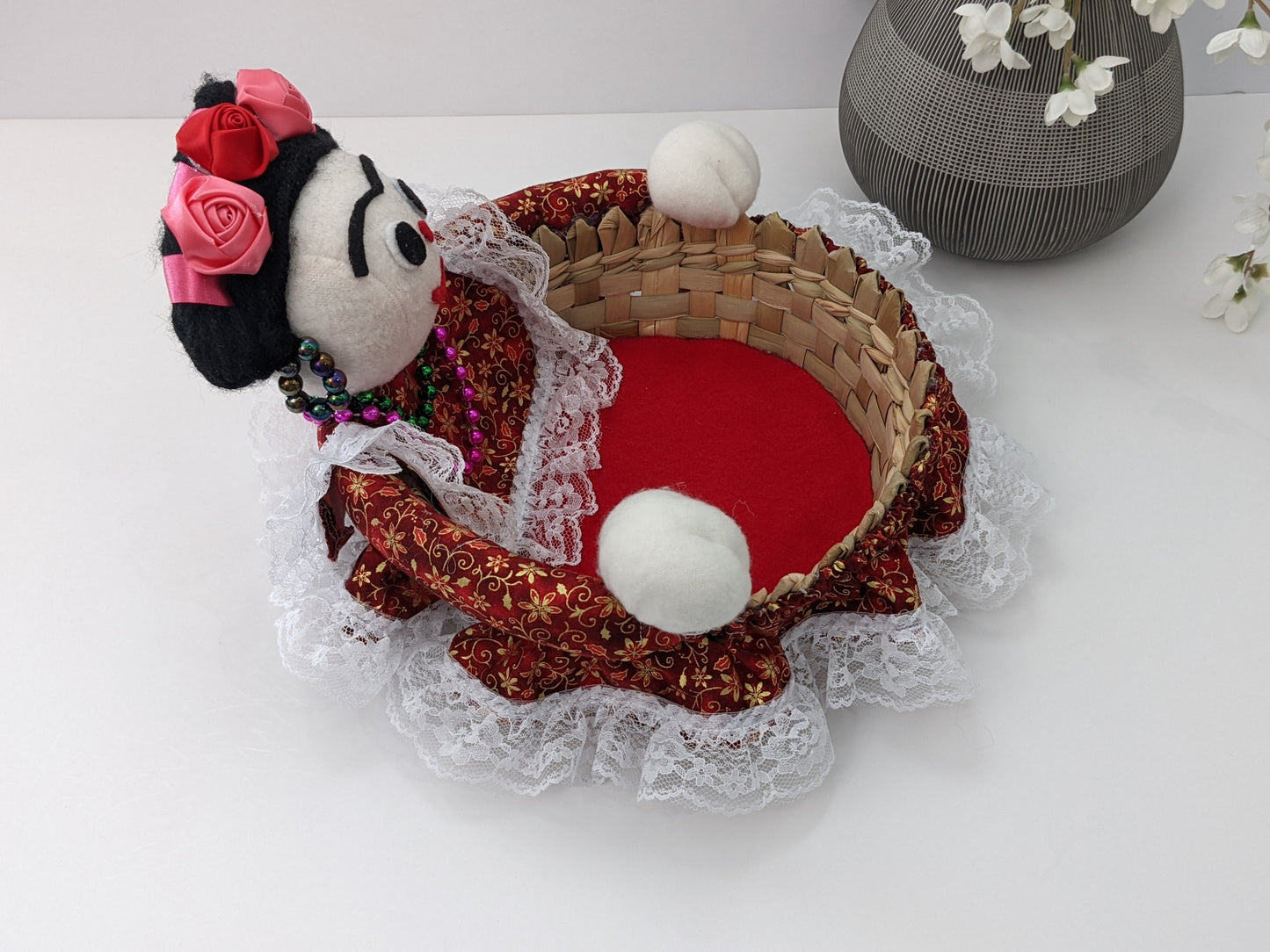 Medium Decorative Basket Frida Kahlo by Luna Marie Designs. She is dressed in red/gold and Kahlo's signature hair Style. Adorned with pink and red roses. Side
