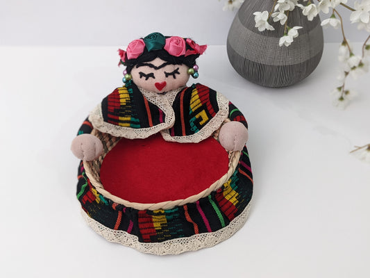 Small Decorative Basket Frida Kahlo by Luna Marie Designs. Our version of  Frida Kahlo- Small Palm Basket  dressed in black cambaya, tipic Kahlo's hair style adorned with multiple ribbon colors and multicolor roses. Frida 0003 Front